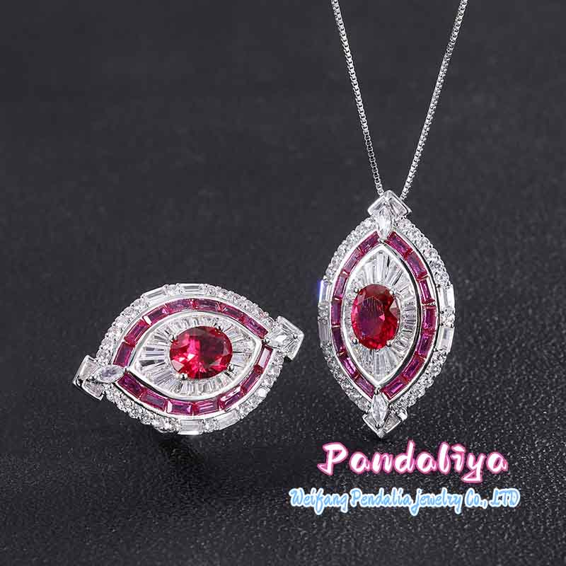 Red ruby set, exquisitely designed, shimmering with full-set diamonds, radiating a magnificent and dazzling brilliance, showcasing luxurious taste.