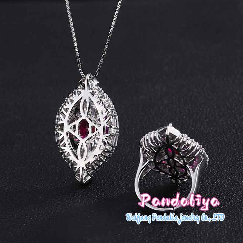 Red ruby set, exquisitely designed, shimmering with full-set diamonds, radiating a magnificent and dazzling brilliance, showcasing luxurious taste.