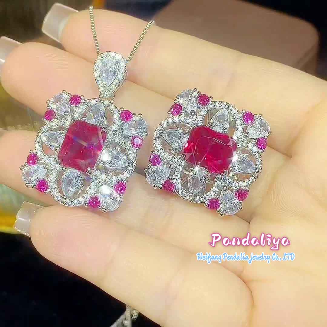 Rectangular gemstone jewelry set, meticulously designed, with dazzling colored gems shining brightly, showcasing a magnificent and colorful charm, capturing attention.