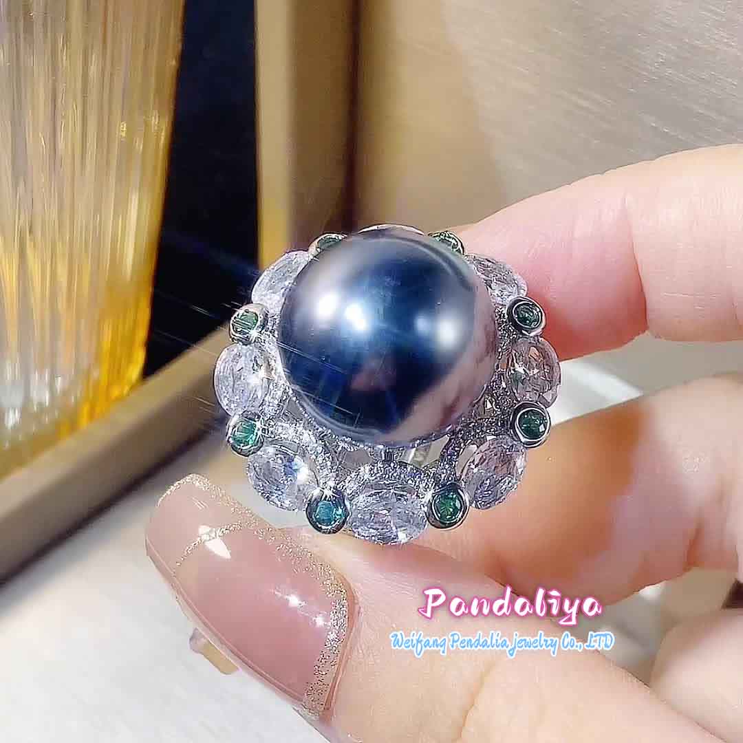 A magnificent ring adorned with large pearls and colorful gemstones, complementing each other perfectly, vibrant and charming, enhancing your unique charm.