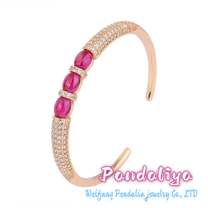 Ruby bracelet, featuring a simple smooth cut design and adorned with dazzling diamonds, showcases unparalleled charm with its passionate and vibrant red hue, making you shine like a star under the spotlight!