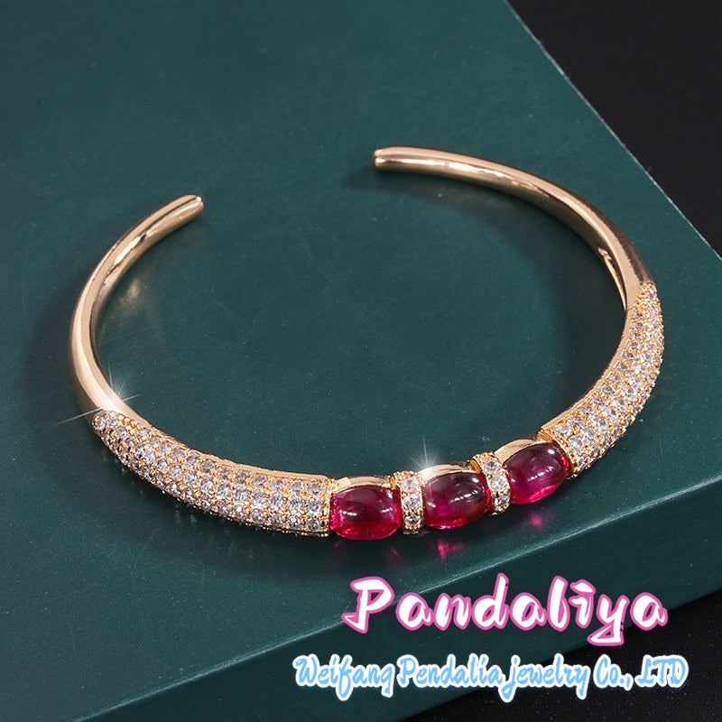 Ruby bracelet, featuring a simple smooth cut design and adorned with dazzling diamonds, showcases unparalleled charm with its passionate and vibrant red hue, making you shine like a star under the spotlight!