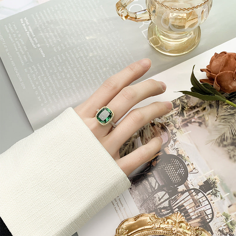 Color gemstone ring, adorned with square diamonds, exudes noble temperament and luxurious style. The delicate ice flower cutting highlights its elegant charm!