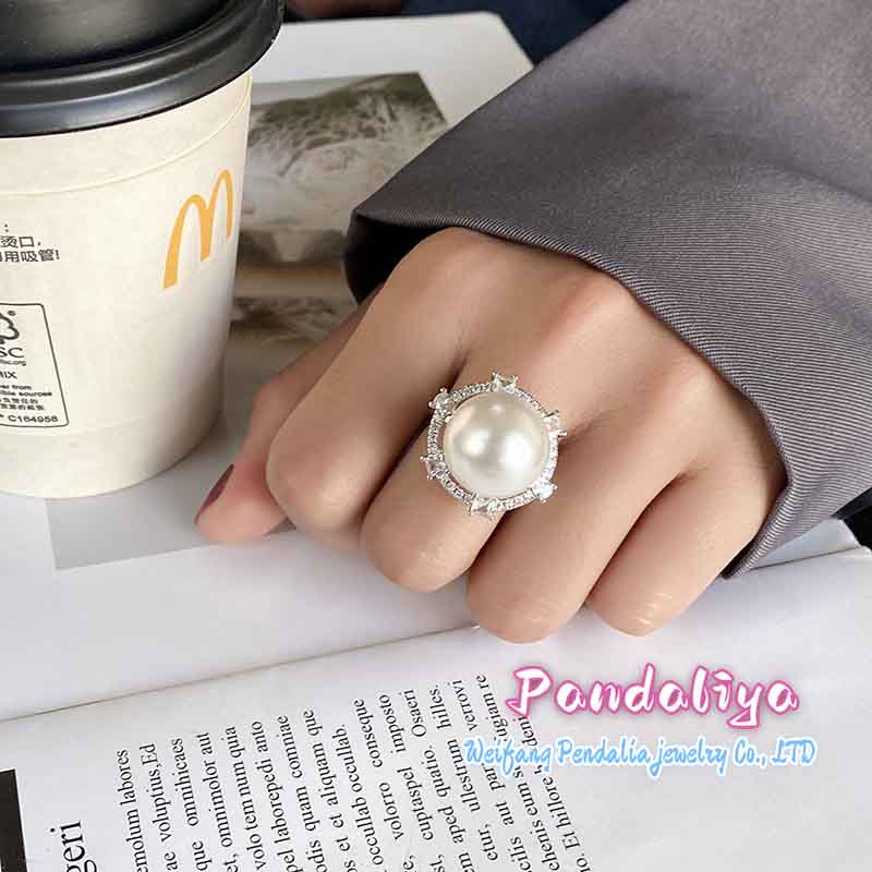 A meticulously crafted ring featuring a selected 16mm pearl design, showcasing unique craftsmanship and exquisite artistry, radiating with dazzling brilliance, truly worthy of collection.