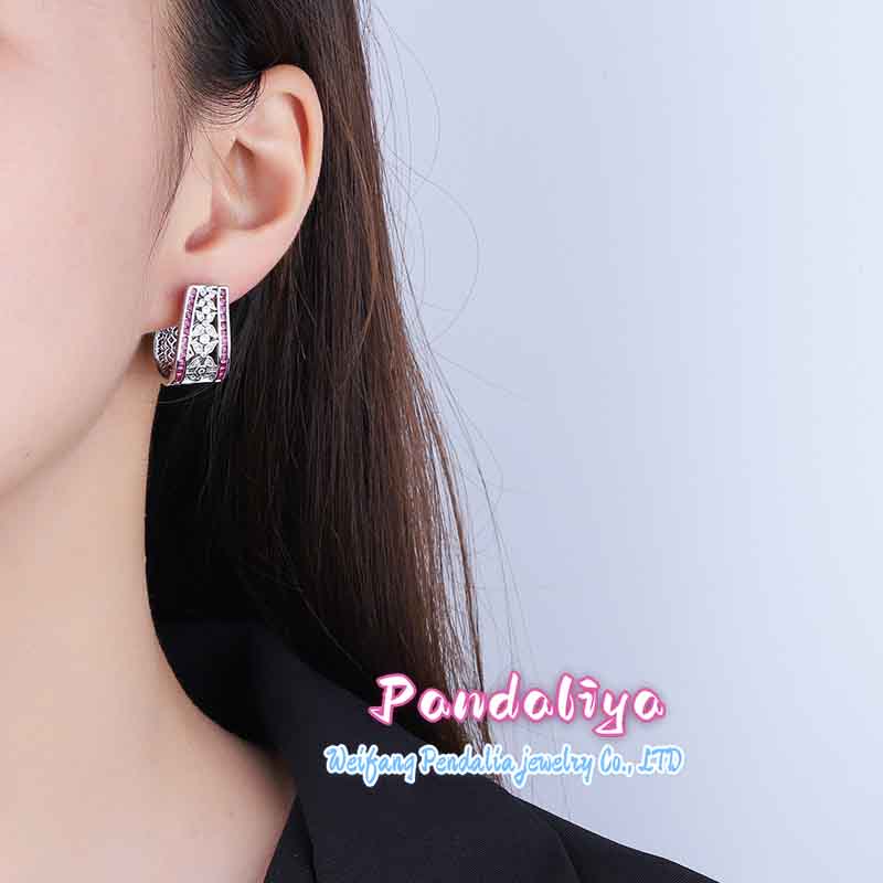 Earrings made of various colored gemstones, with a beautiful hollow design, exude elegance, and crafted from hypoallergenic materials for safe wearing.