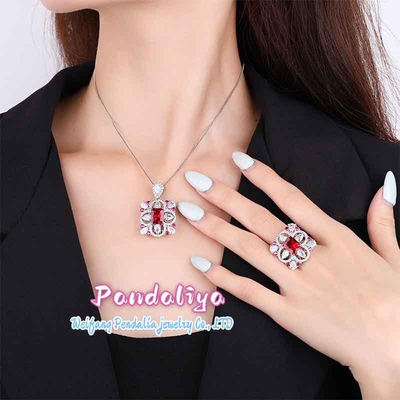 Rectangular gemstone jewelry set, meticulously designed, with dazzling colored gems shining brightly, showcasing a magnificent and colorful charm, capturing attention.