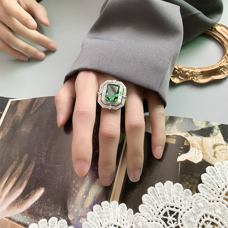 Color Gemstone Ring adorned with square diamonds, emitting charming radiance, seamlessly blending luxurious elegance with glamorous design, showcasing impeccable fashion taste!