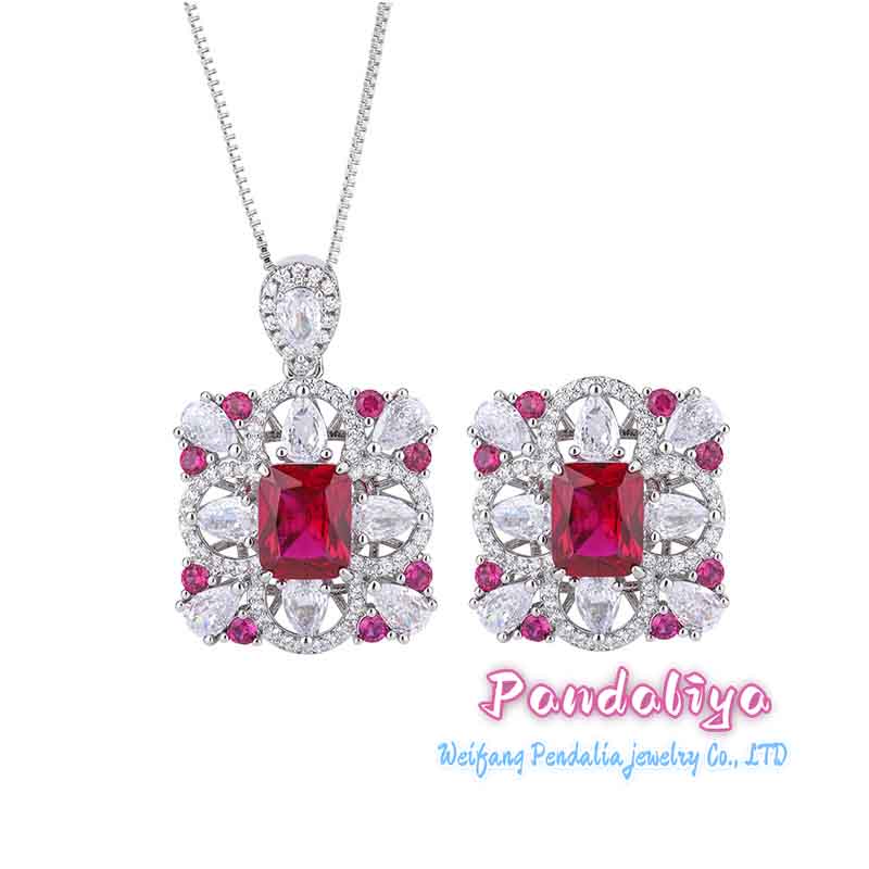 Rectangular gemstone jewelry set, meticulously designed, with dazzling colored gems shining brightly, showcasing a magnificent and colorful charm, capturing attention.