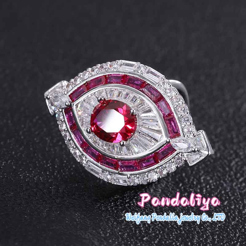 Red ruby set, exquisitely designed, shimmering with full-set diamonds, radiating a magnificent and dazzling brilliance, showcasing luxurious taste.