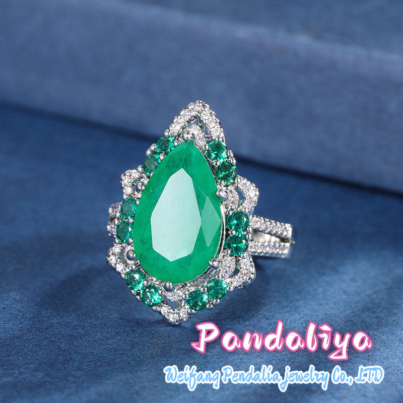 Colorful gemstone ring with water drop design, adorned with sparkling diamonds, radiating charming brilliance, truly eye-catching!