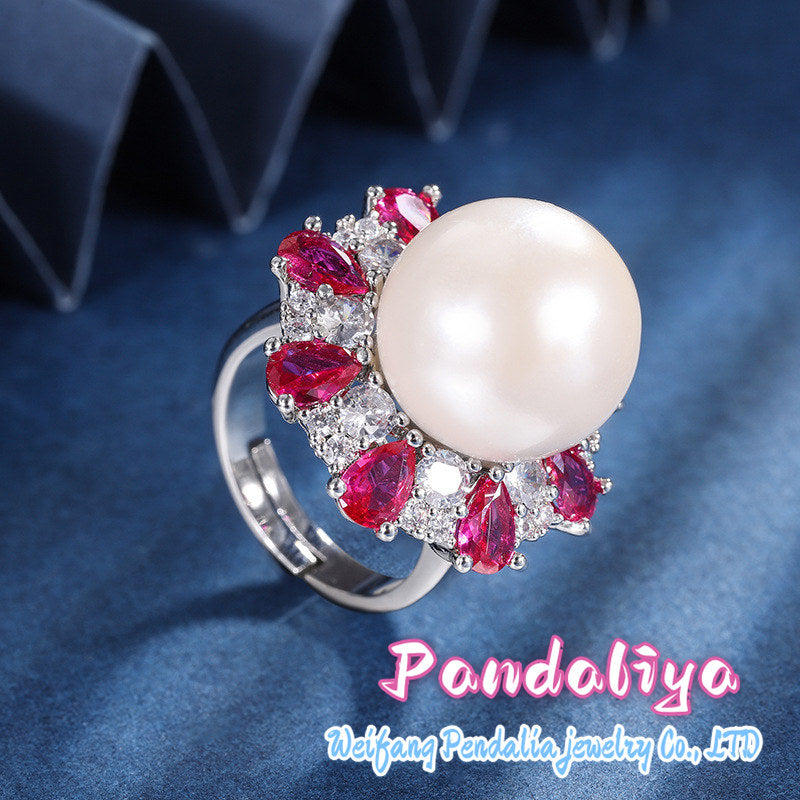 The white pearl ring, adorned with sparkling colorful gemstones, resembles blooming flowers, vibrant and colorful, showcasing the splendorous life of women!