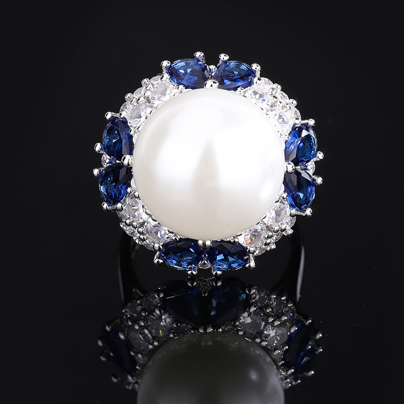 Flower-shaped, adorned with colored gems, this pearl ring is splendid and luxurious, showcasing your noble taste.