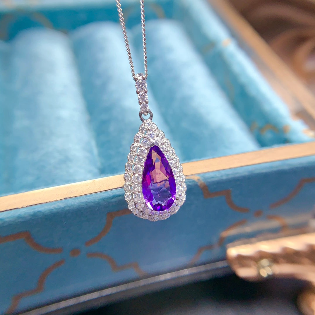 Natural crystal anf Sapphire necklace, teardrop-shaped, handcrafted with each stone being a large natural zircon. A luxurious piece to adorn your neck.