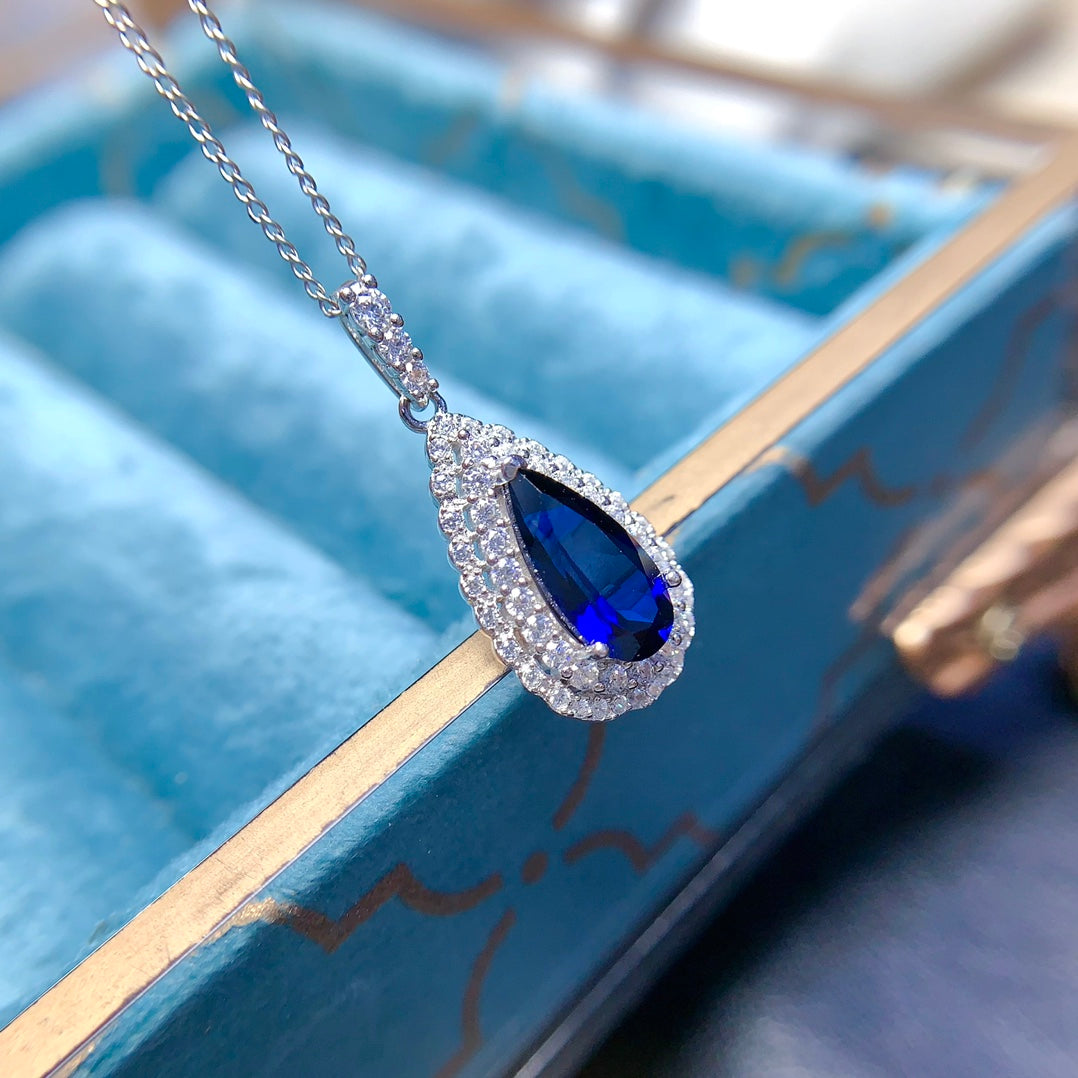 Natural crystal anf Sapphire necklace, teardrop-shaped, handcrafted with each stone being a large natural zircon. A luxurious piece to adorn your neck.