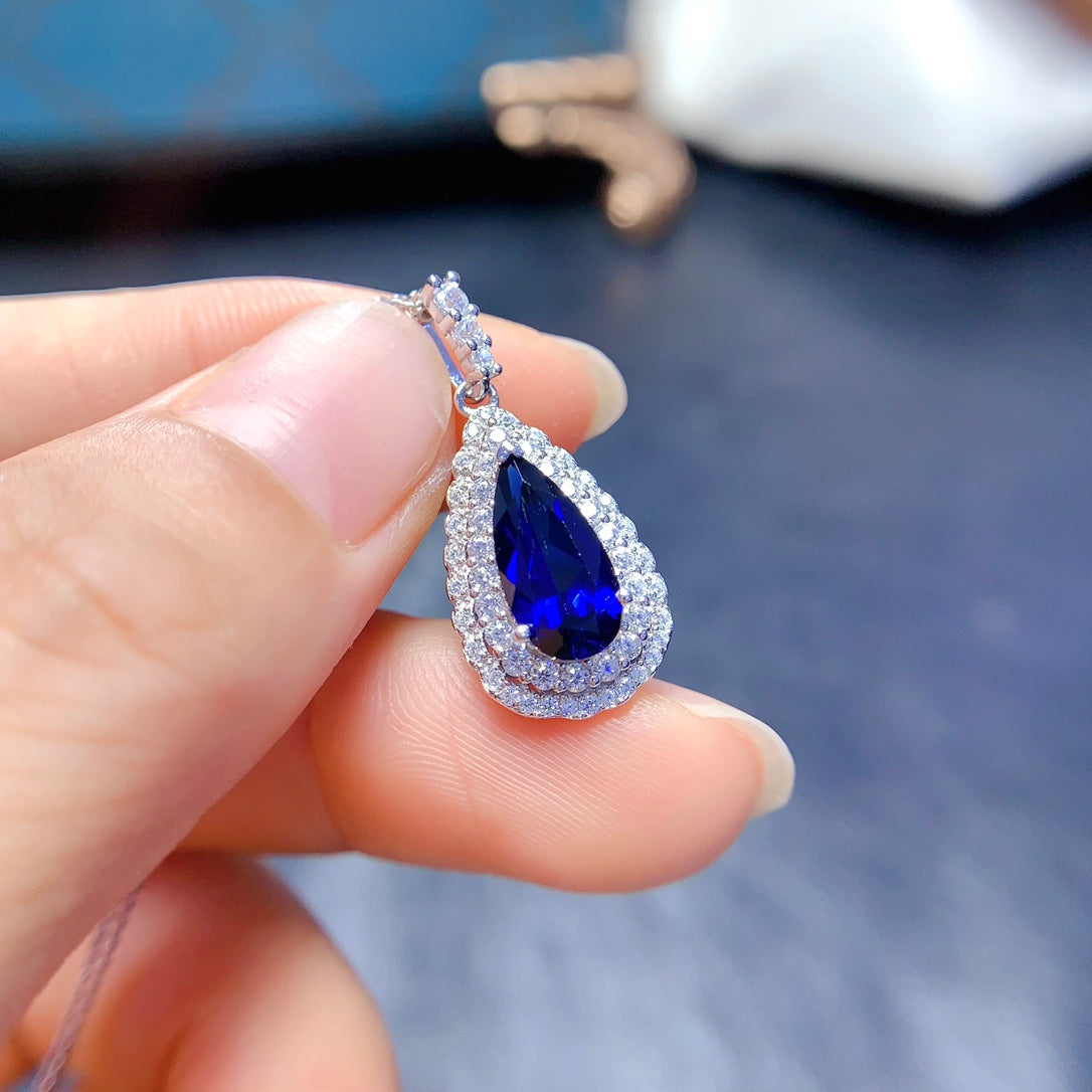 Natural crystal anf Sapphire necklace, teardrop-shaped, handcrafted with each stone being a large natural zircon. A luxurious piece to adorn your neck.