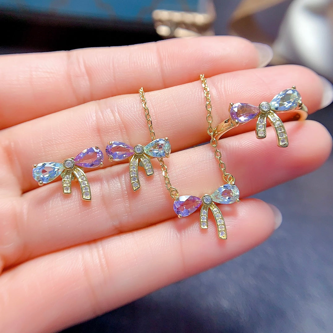 A set made of natural Topaz and crystal, featuring a cute bow design. The combination of two different colors makes it even more delicate.