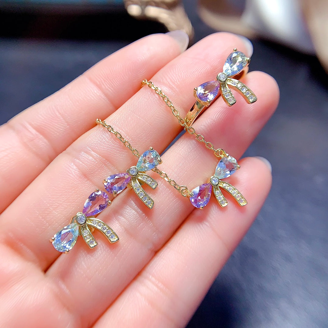 A set made of natural Topaz and crystal, featuring a cute bow design. The combination of two different colors makes it even more delicate.