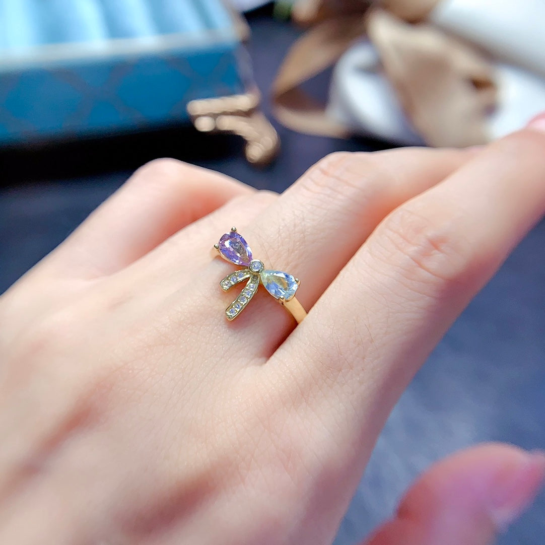 A set made of natural Topaz and crystal, featuring a cute bow design. The combination of two different colors makes it even more delicate.