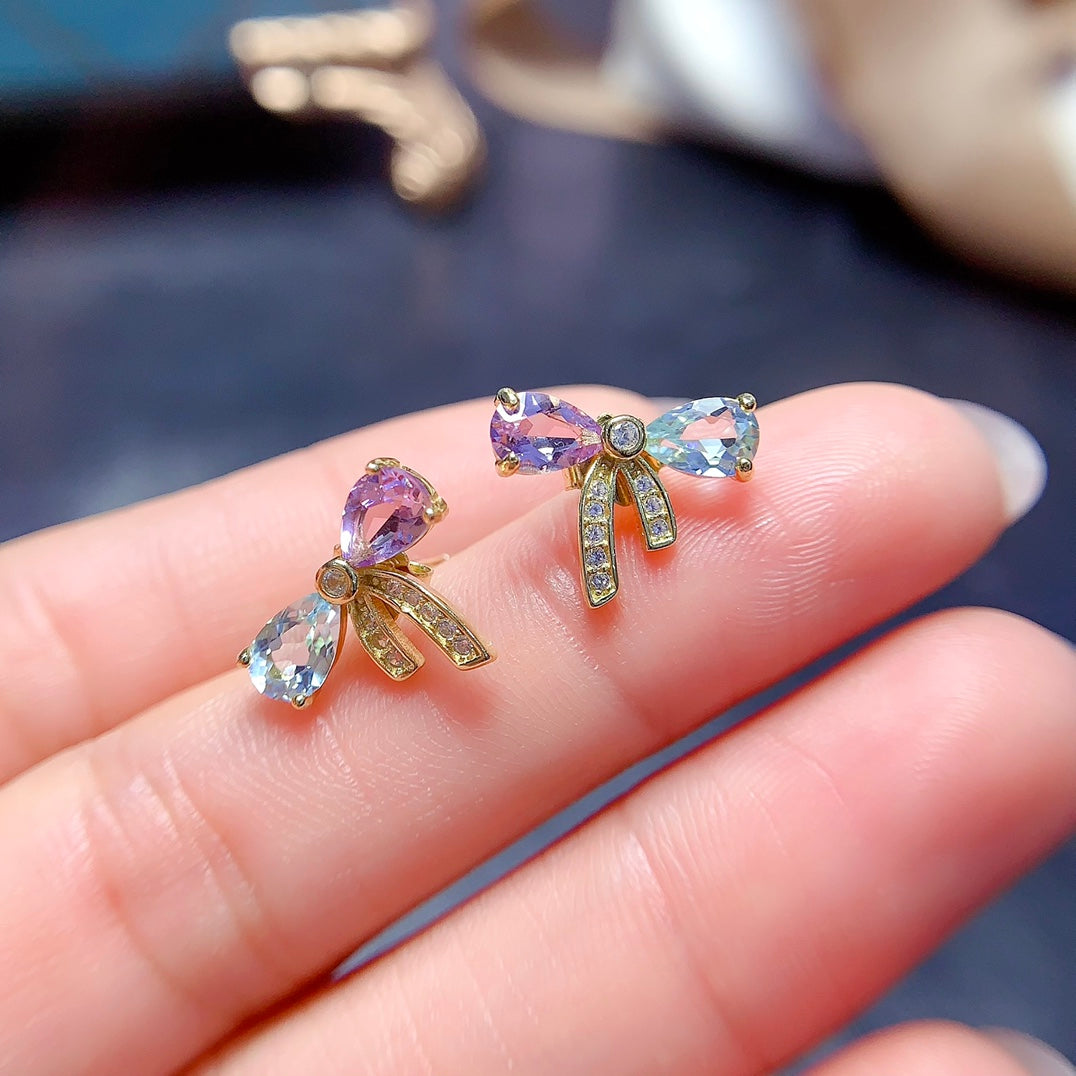 A set made of natural Topaz and crystal, featuring a cute bow design. The combination of two different colors makes it even more delicate.